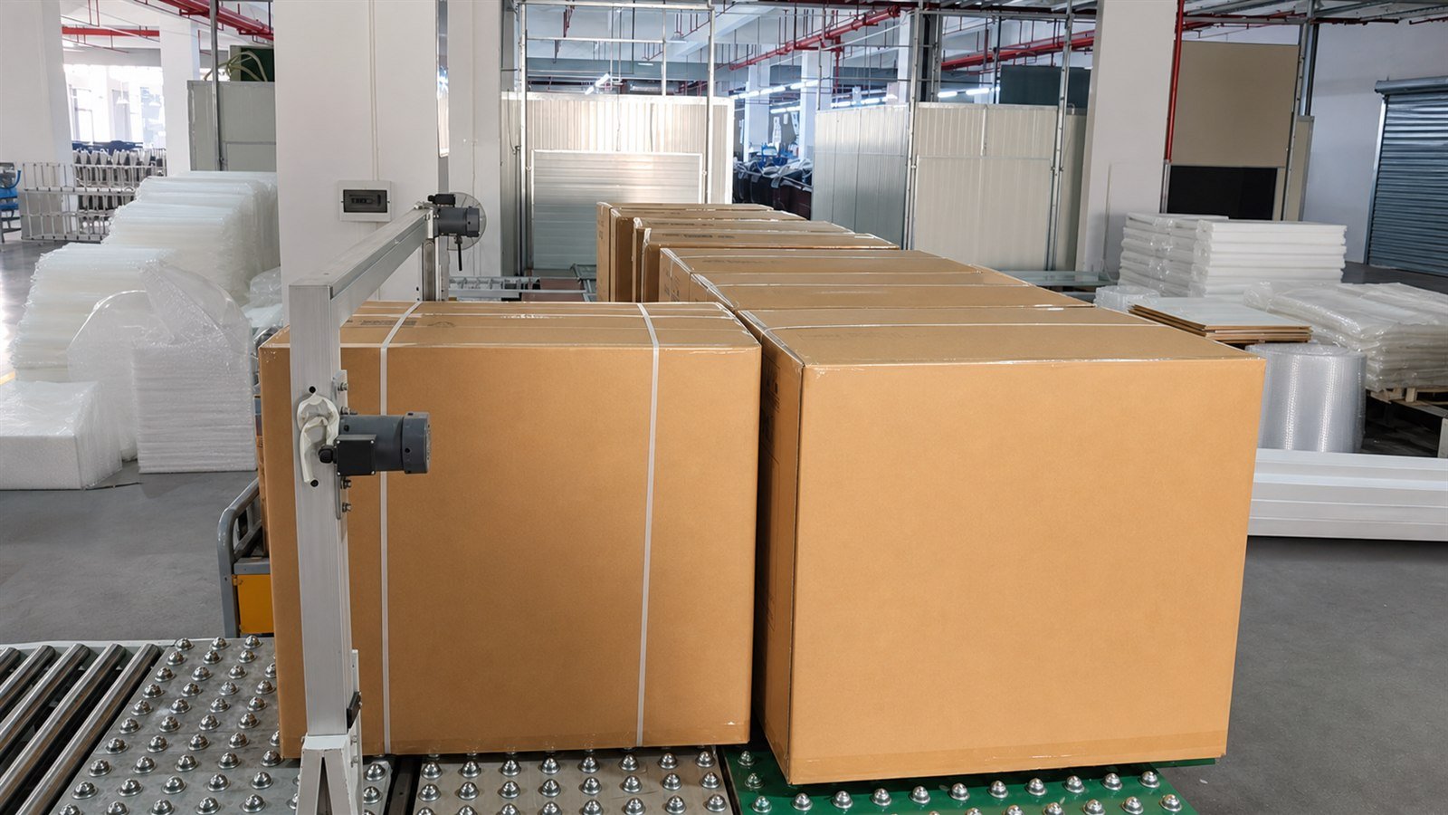 Massage chair cartons sealed on the Rongqin packing line