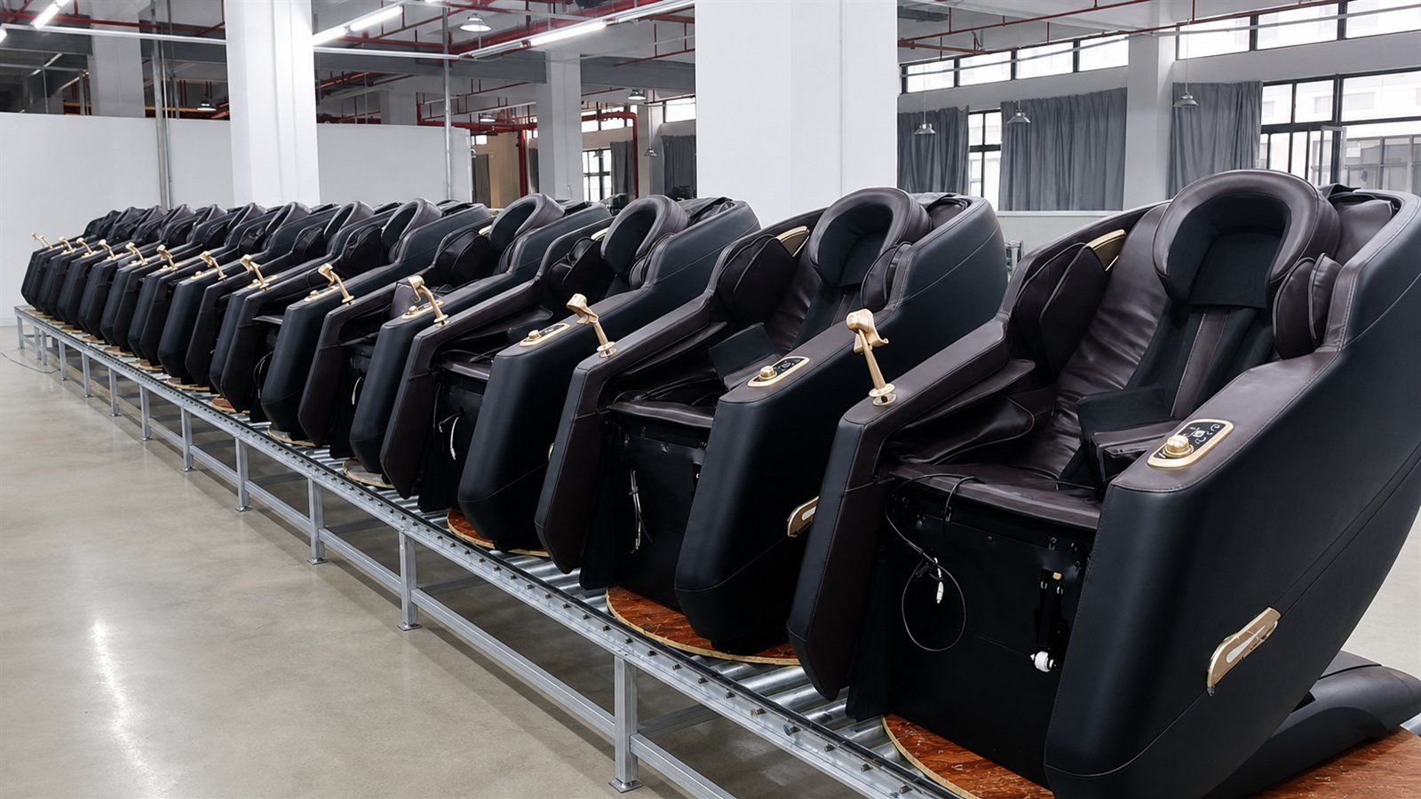 Black massage chairs arranged on the Rongqin production line